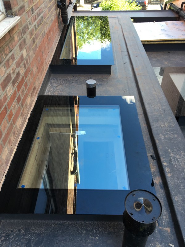 Multiple flat roof skylights on extension in Coulsdon